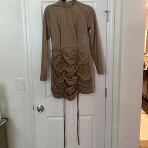 Cute Faux Leather long sleeve mini dress.